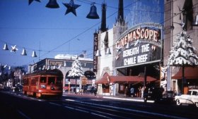 With an old LA Red Car trolley giving it a touch of holiday color, Graumans Chinese Theater on Hollywood Boulevard at Christmas time, 1953. (privatelosangelestours.com)