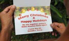 The card has the phrase 'Happy Holidays' which Trump has rallied against